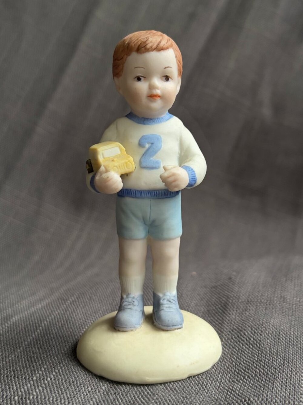 Vintage Hand Painted Porcelain Boy Figurine in Blue Outfit 1983